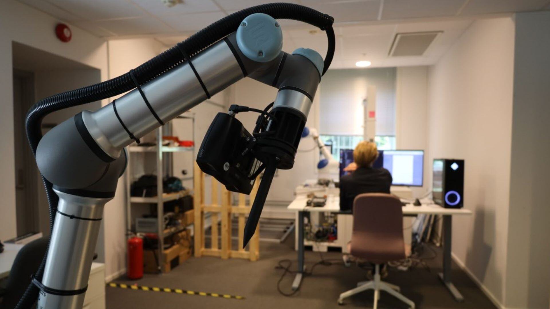 robot-mounted camera in front of a man